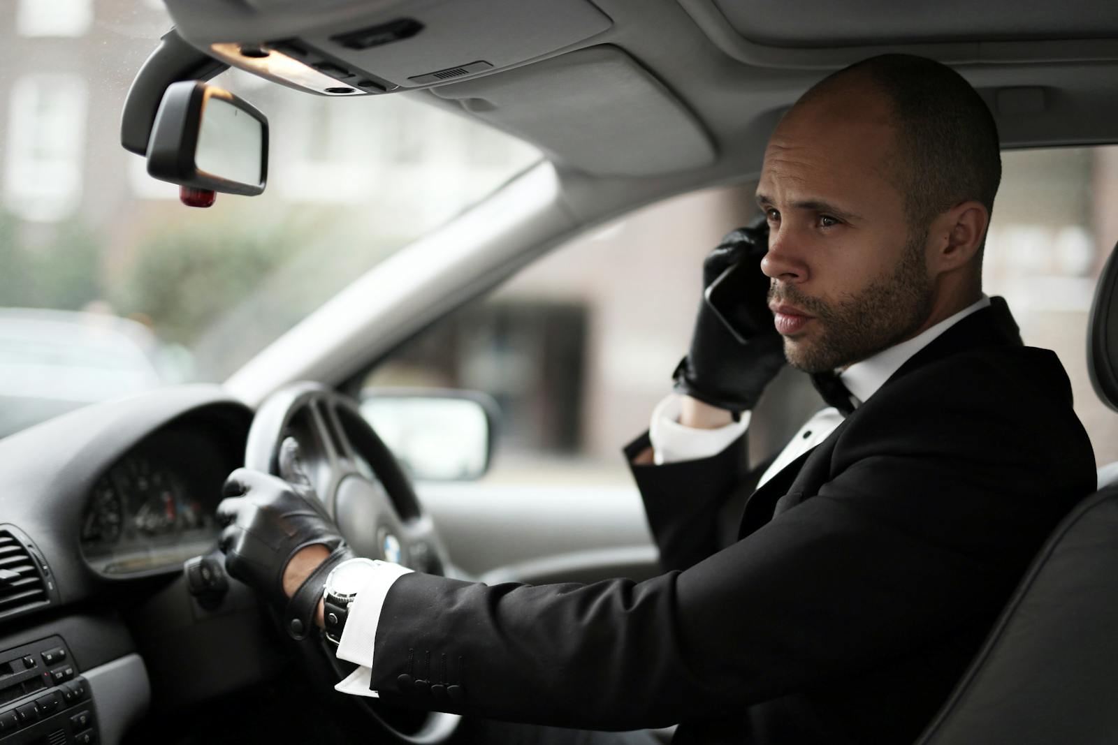 Professional chauffeur with executive passenger